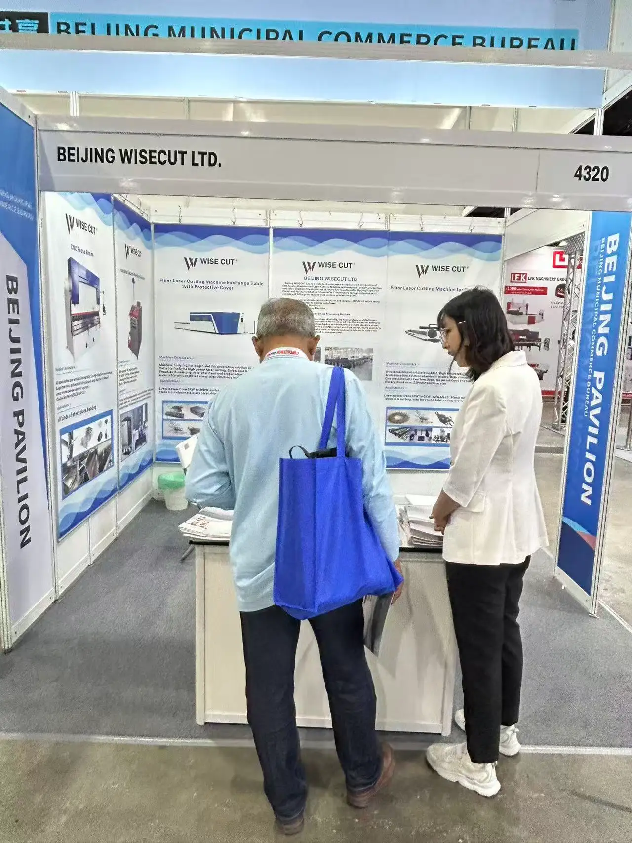 Laser cutting welding and CNC press brake solutions displayed at an industrial exhibition booth